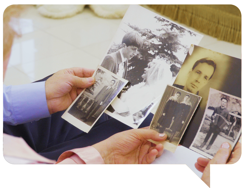 Two people looking at photos for reel stellar memories